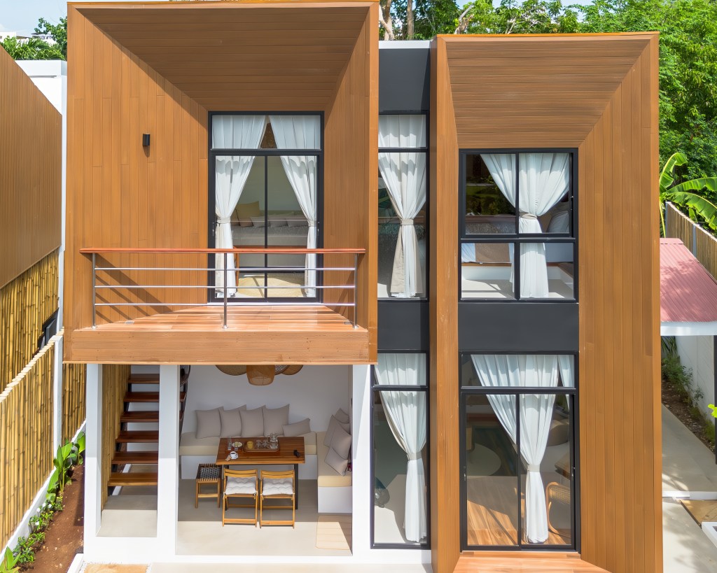 Private Villa Interior with Pool Access – Bird of Paradise Bohol
Modern tropical villa room with earthy tones, leafy mural wall art, and direct access to a private plunge pool through glass doors.