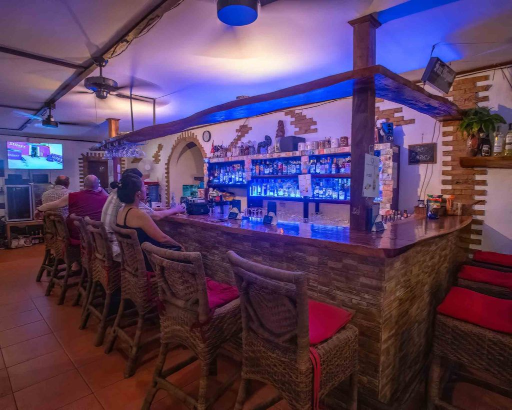 The main bar at TipTop Resto, a frequent meeting spot for expats and locals to watch football matches.